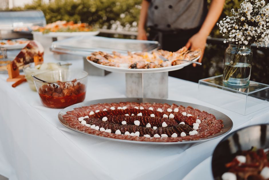 Professional Italian catering presentation with carefully arranged dishes